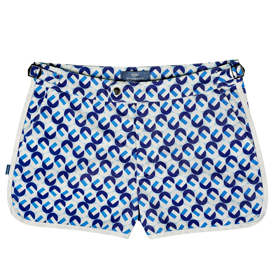 Product shot of Shoreliner swim shorts by BroadReach resort wear in Liberty Fabrics Dancing print.