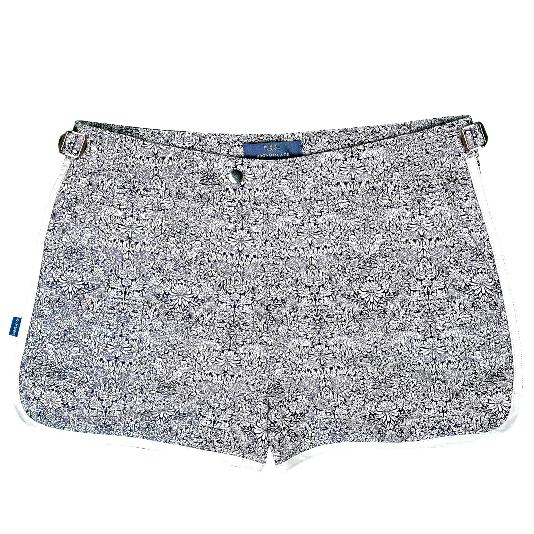 Product shot of Shoreliner swim shorts by BroadReach resort wear in Liberty Fabrics Survival print.