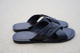 Image of men’s leather Lagoon sandals by BroadReach resort wear against sand backdrop.